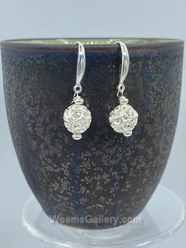 Beautifully swirled sterling silver beads dangle from a stunning sterling French wire by Suzanne Woodworth